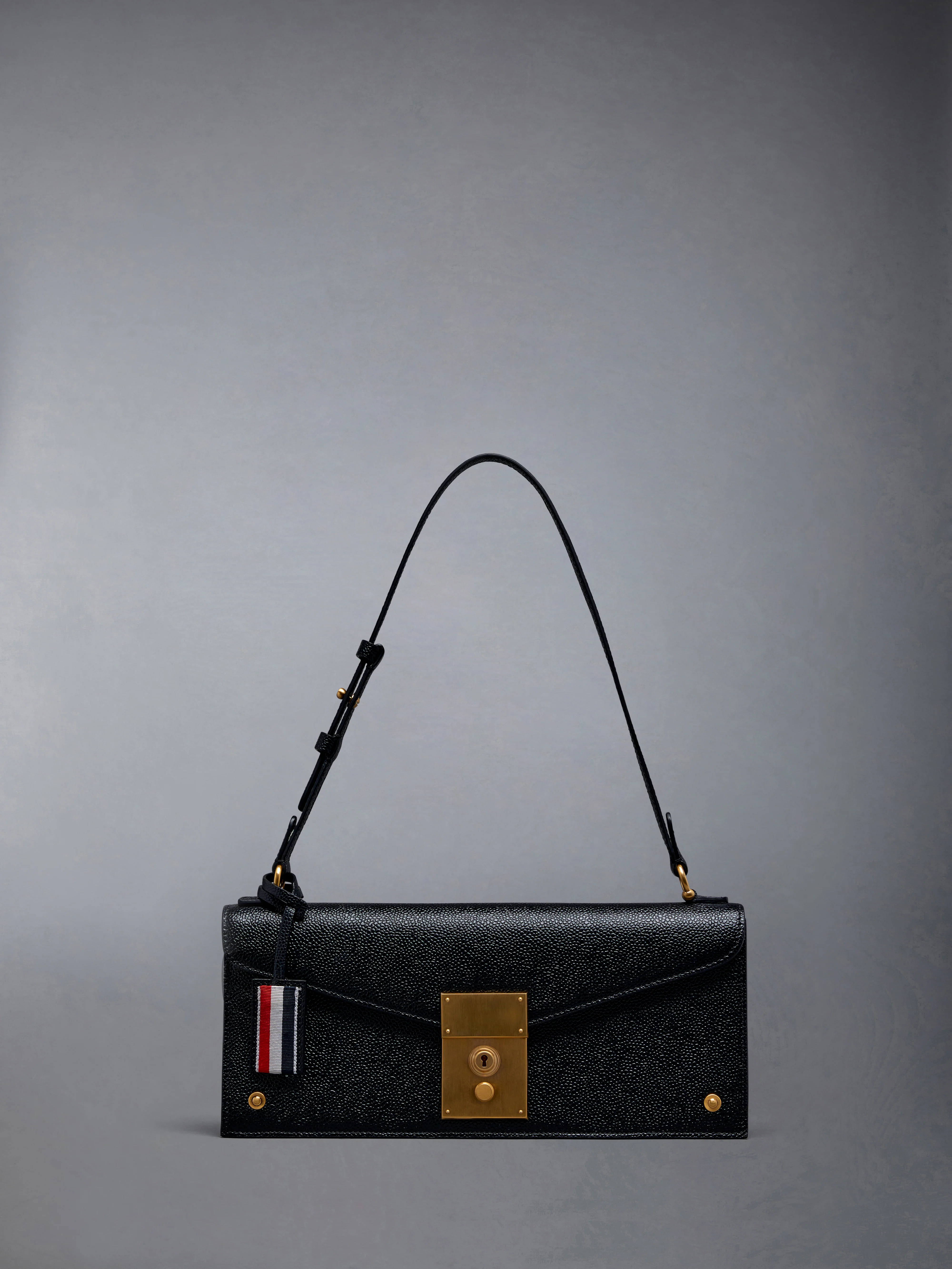 MRS. THOM CLUTCH IN PEBBLE GRAIN LEATHER