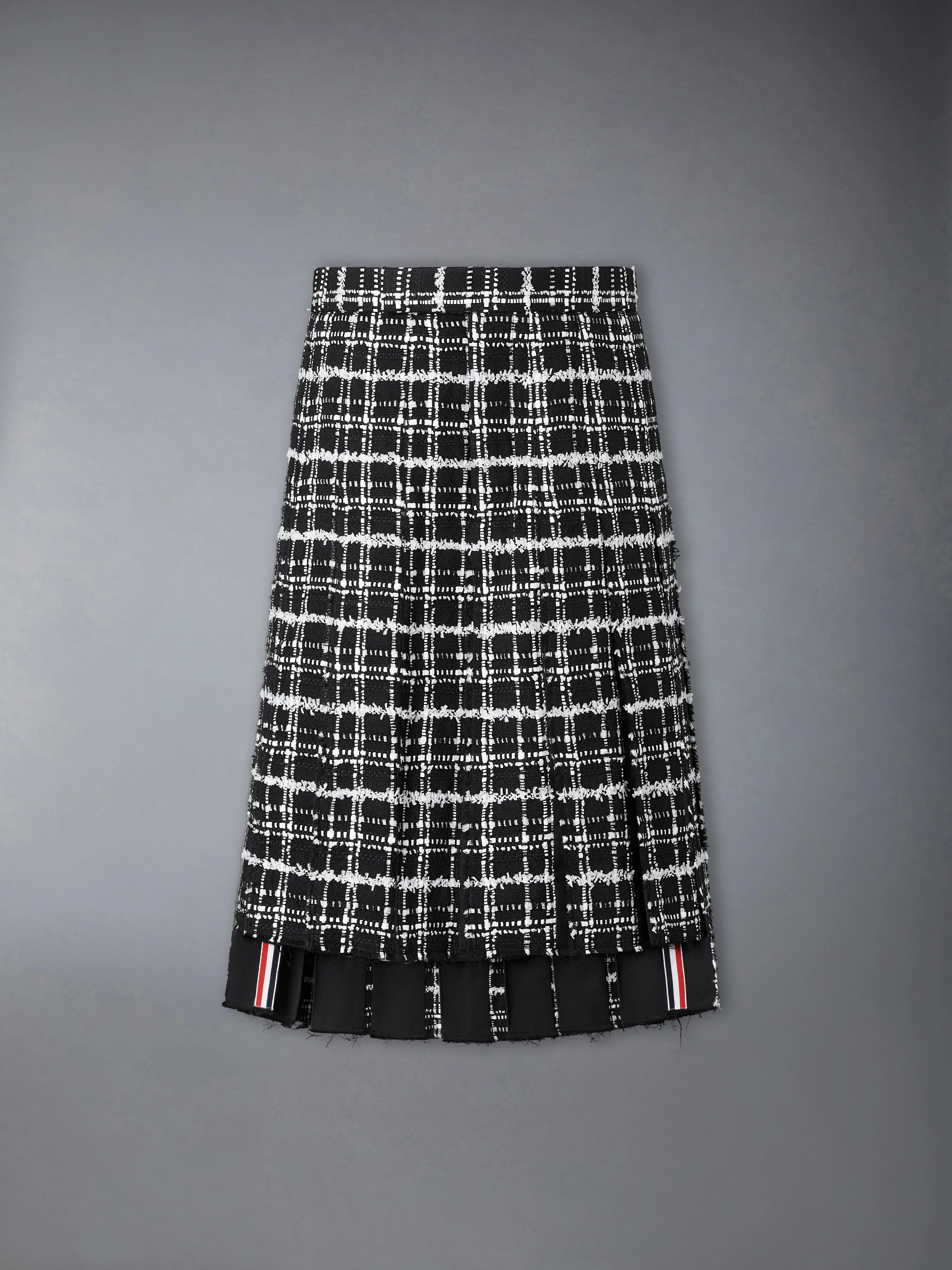 RIBBON TWEED PLEATED SKIRT WITH FRAY EDGE
