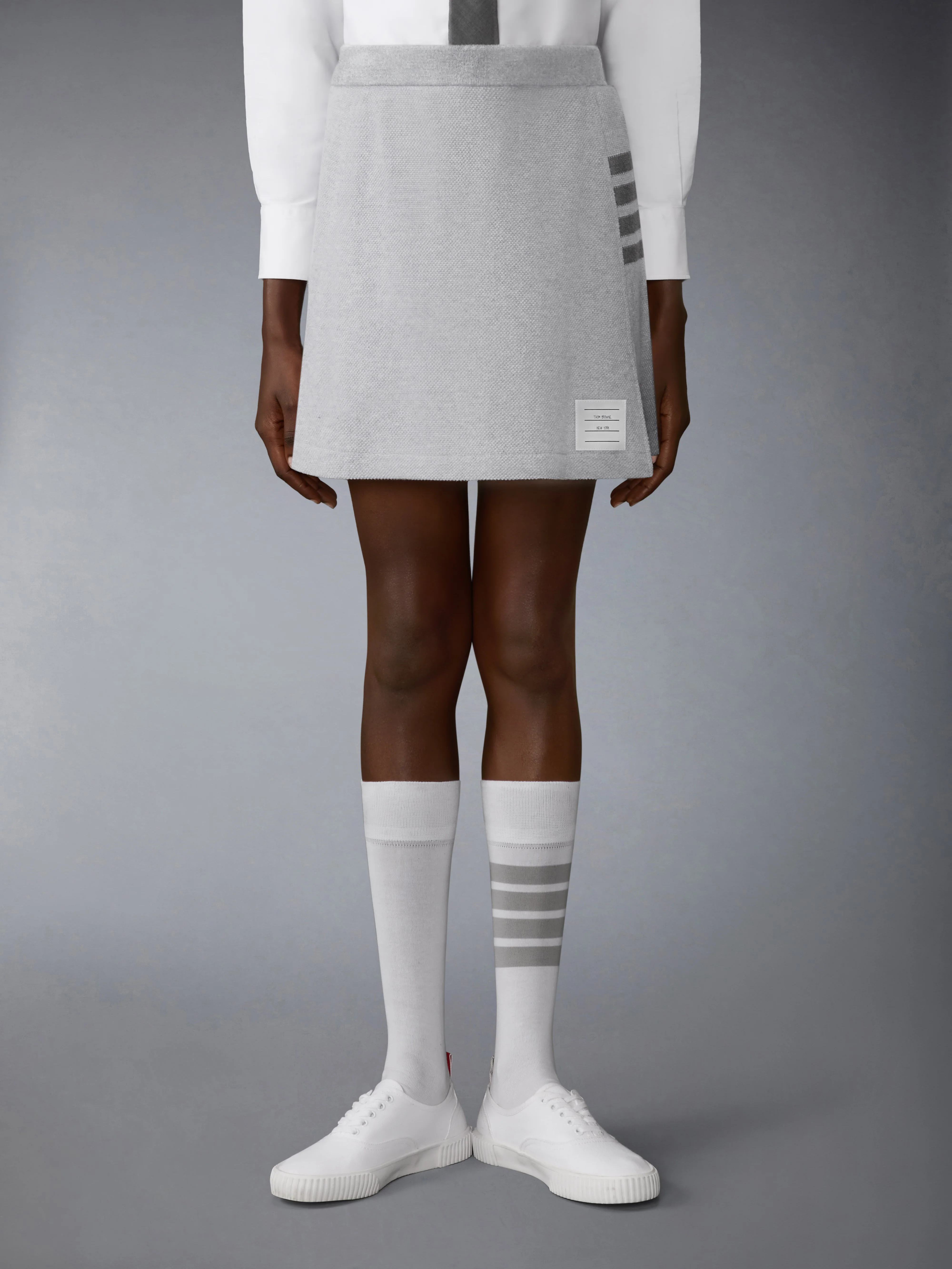 TEXTURED PIQUE 4-BAR BOX PLEAT MINI SKIRT